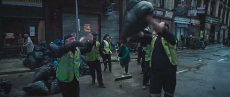 A screenshot from Coinbase's musically-charged ad depicts the UK as littered with rats and trash